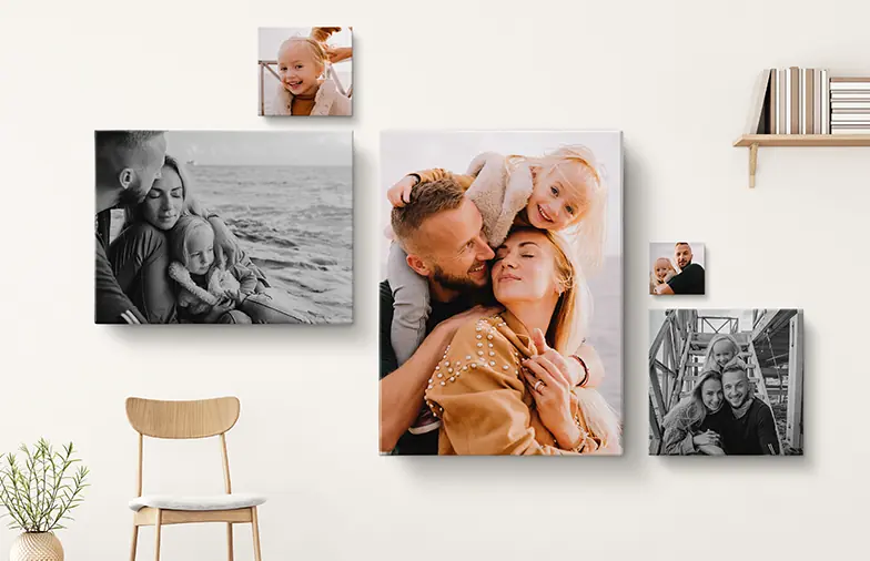 Canvas prints of a family on a living room wall