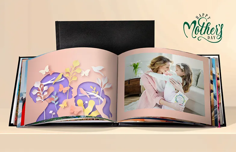 Custom made photo album open on table with photo collage of family photos